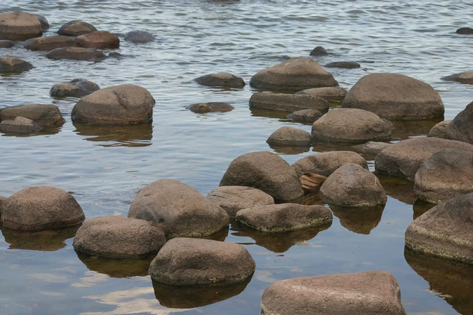 A body of water with rocks in it